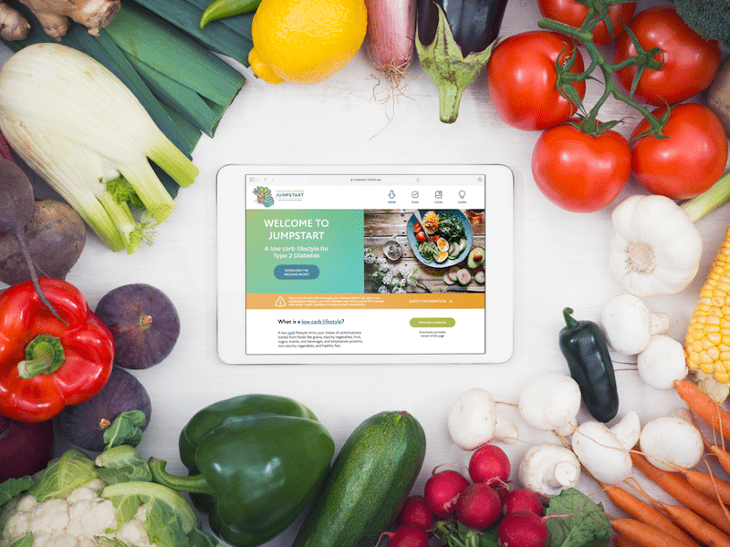jmir protocol jumpstart thumbnail tablet showing the jumpstart website surrounded by fresh veggies and fruits